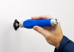 Security-guard-on-patrol-reading-checkpoint